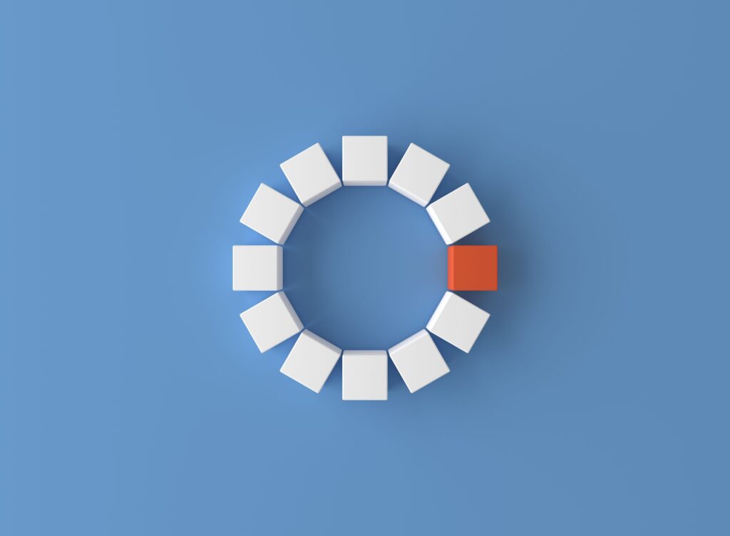 White pieces forming a circle with one orange piece in between