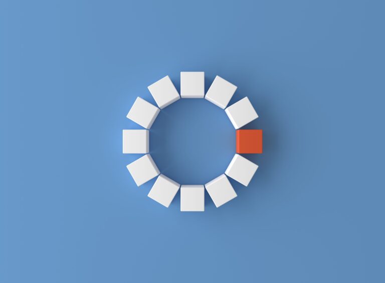 White pieces forming a circle with one orange piece in between