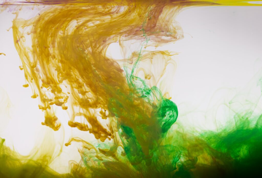 Green and yellow liquids mixing